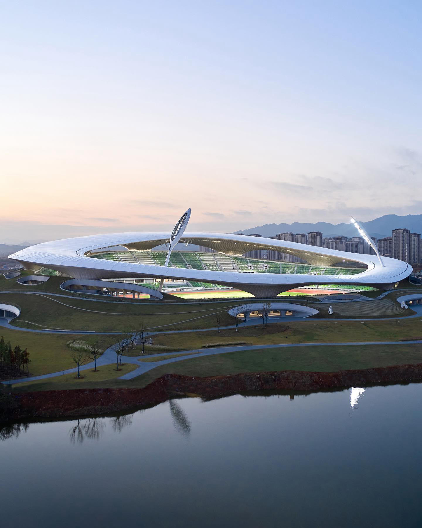image  1 designboom magazine - #madarchitects completes the sinuous stadium at its #quzhou sports park